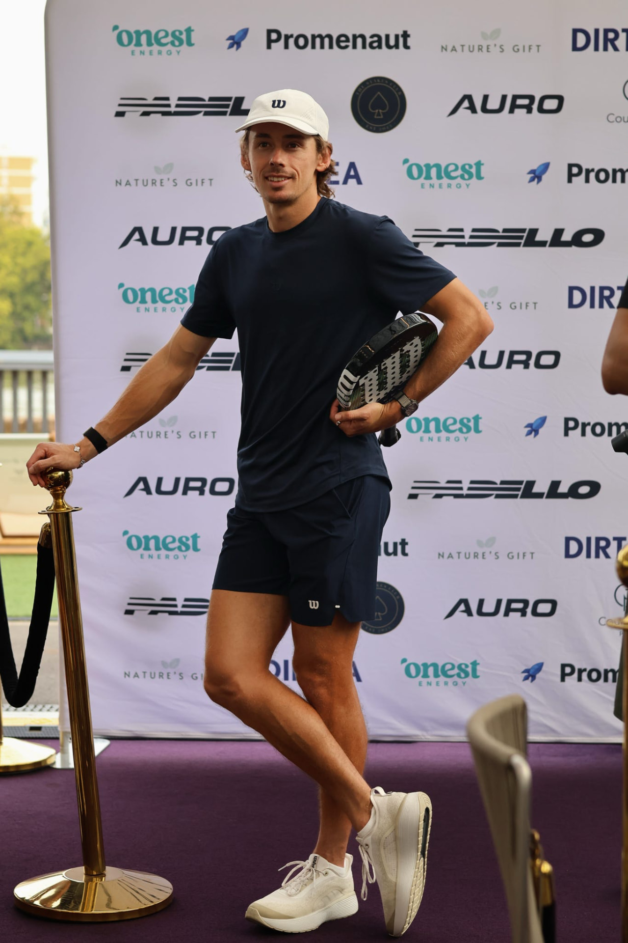 A guest arriving with his padel racket at a Stakes Club event